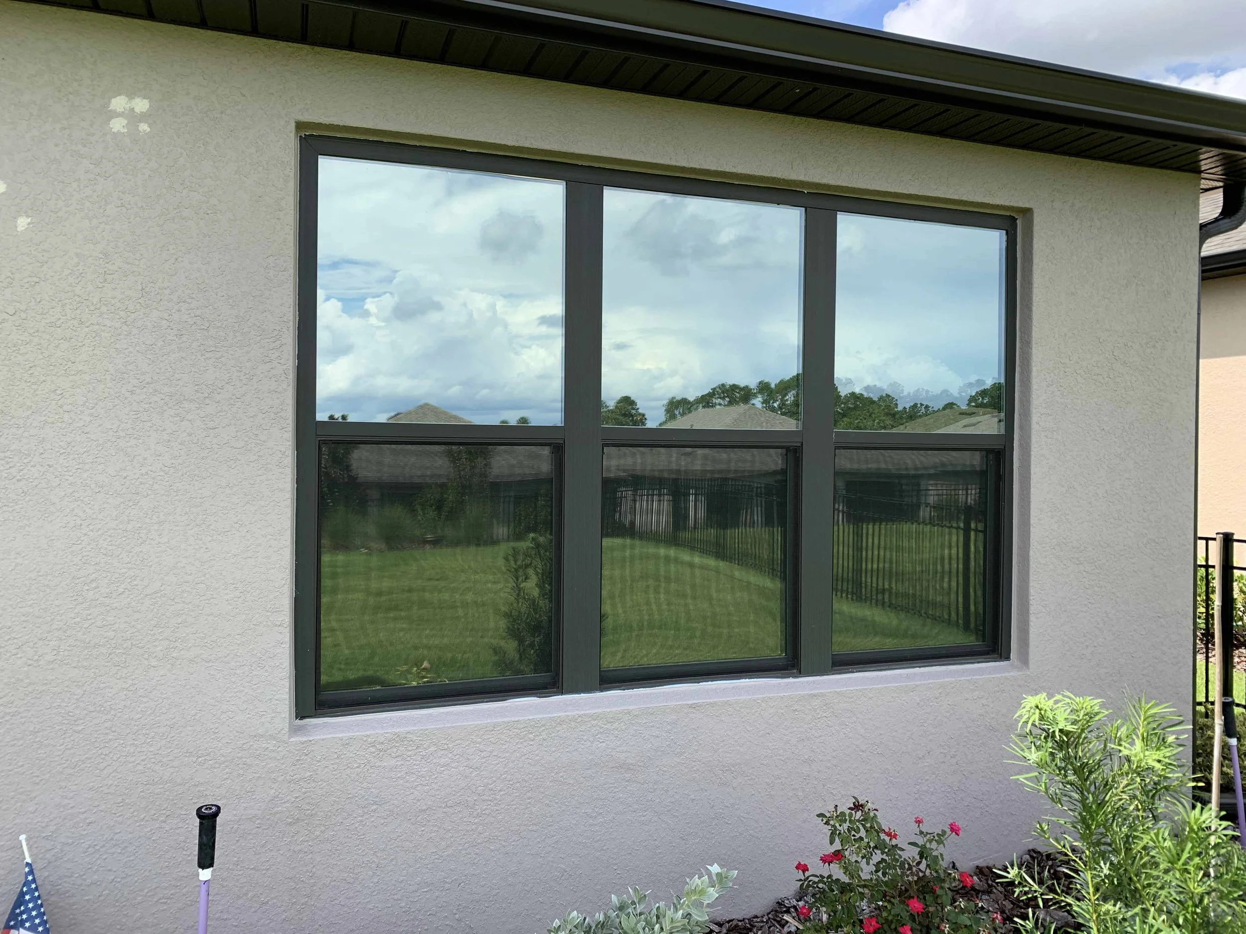 Commercial architectural reflective window film installation completed by First Class Detail